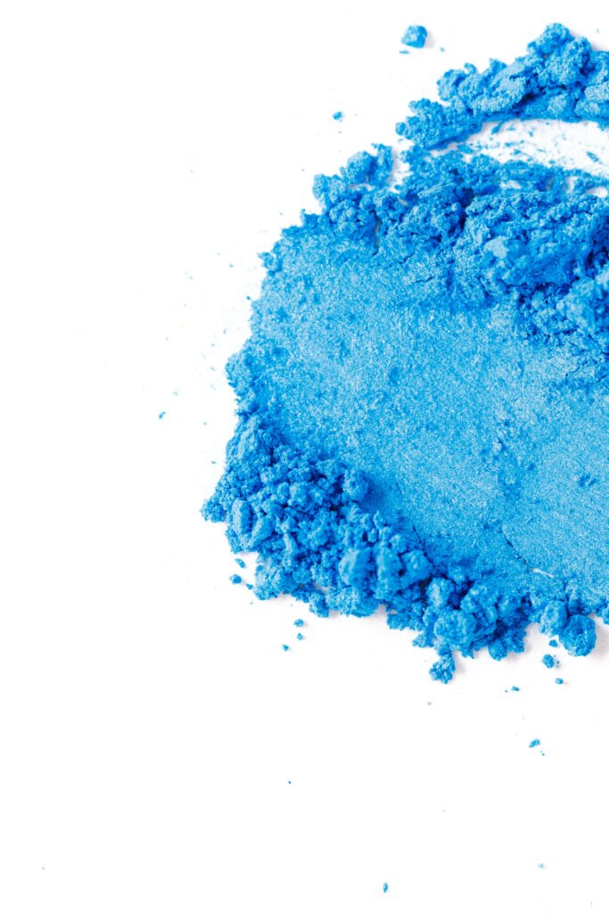 crushed blue eye shadow isolated on white background